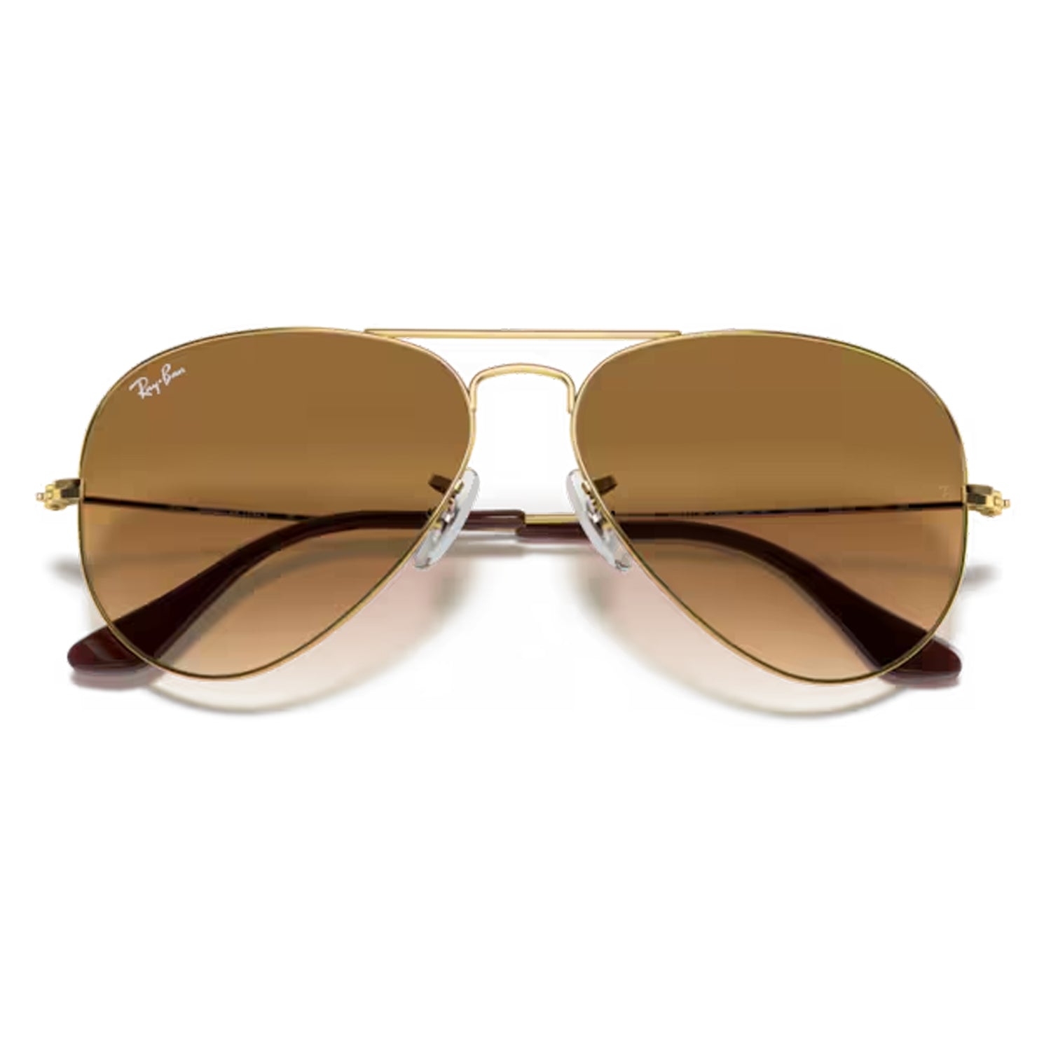 pair of folded ray ban Aviator Large Metal Sunglasses in gold and brown