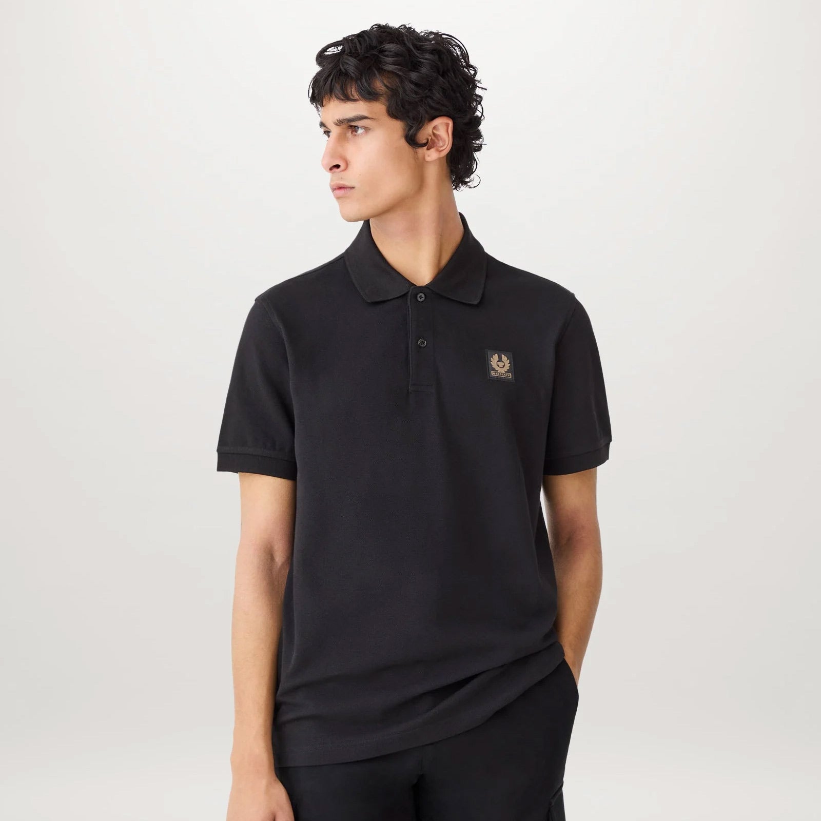 man wearing belstaff polo shirt in black