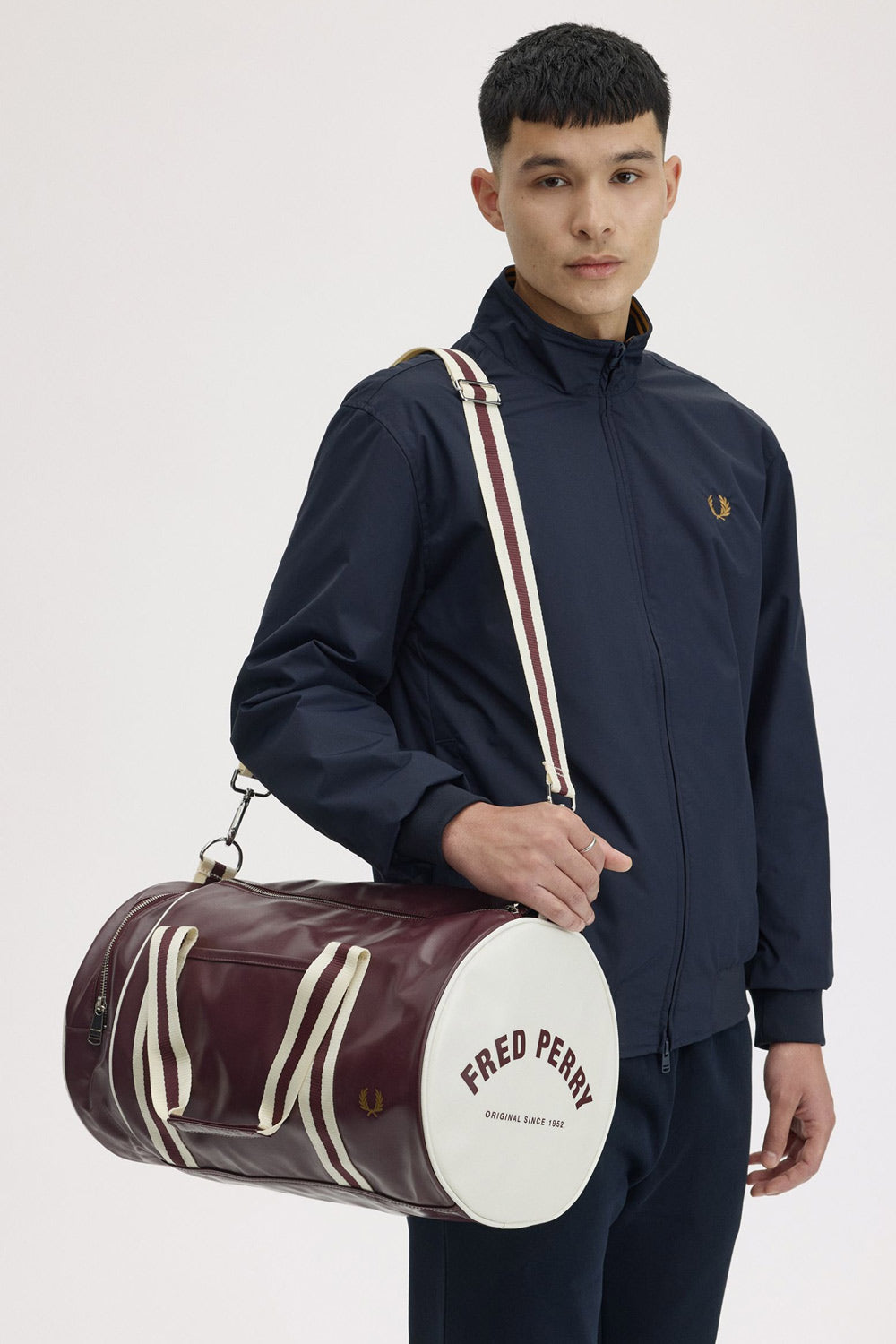 man wearing a fred perry Classic Barrel Bag Oxblood Ecru over his shoulder