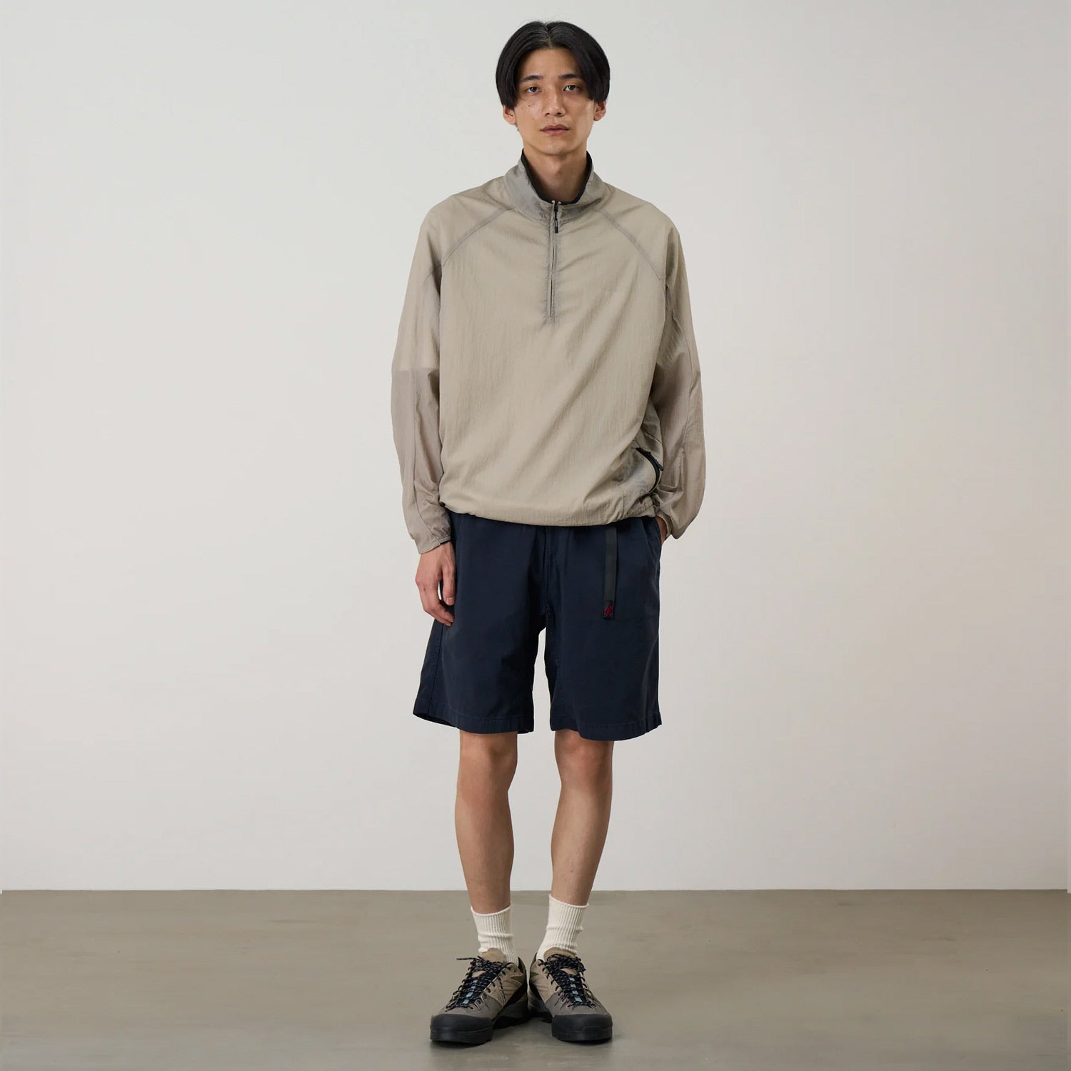 Model wearing Gramicci g-shorts in double navy