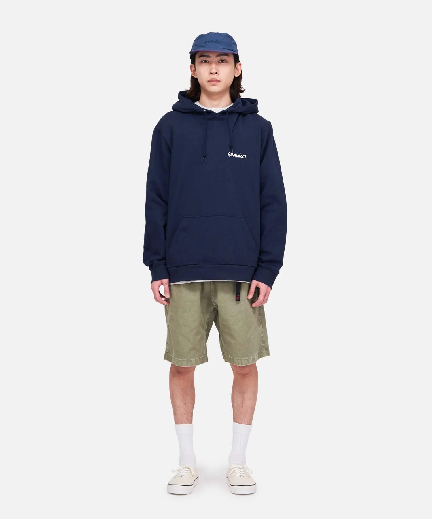 Model Wearing Gramicci G-Shorts in Herb