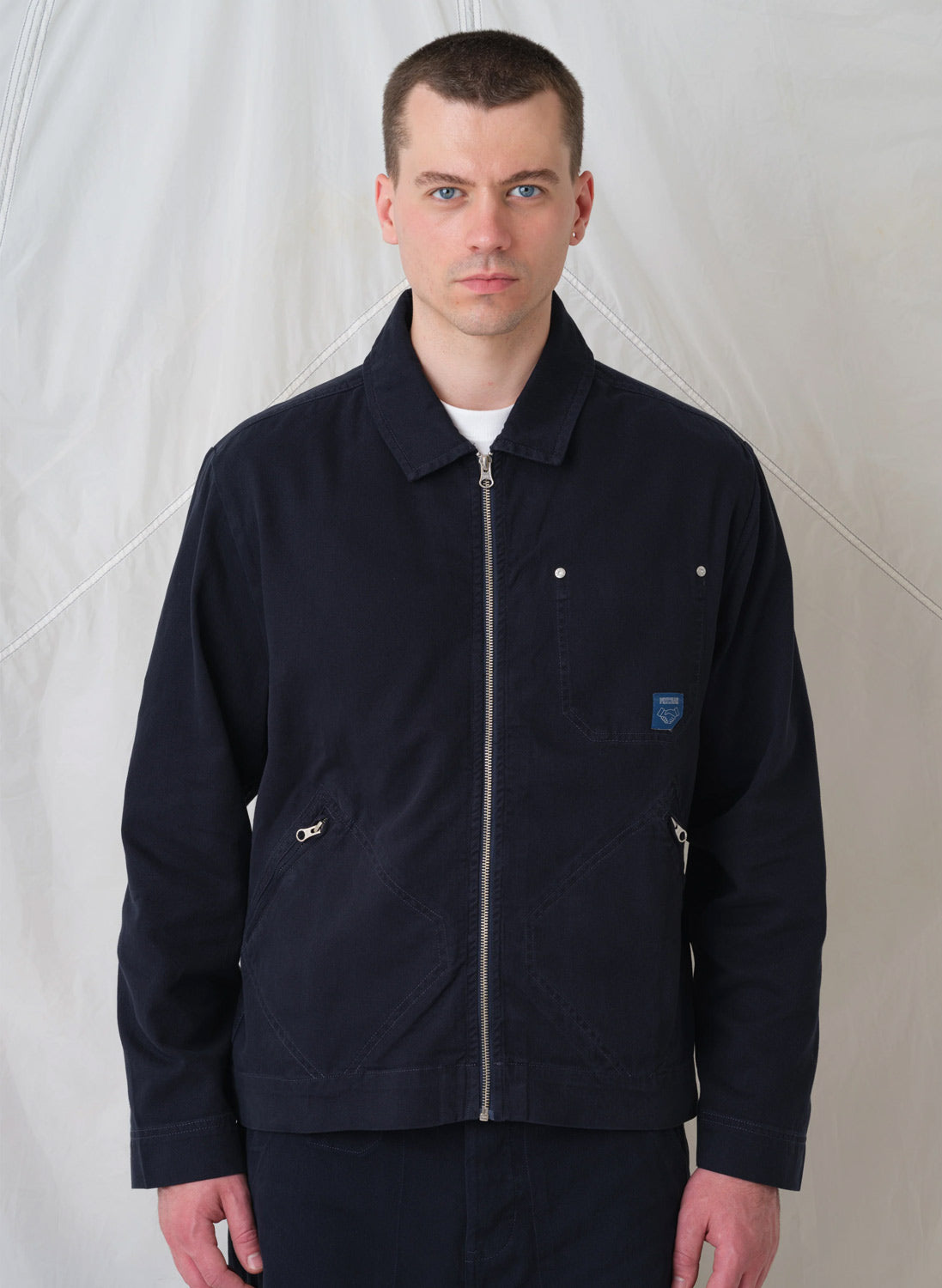 Man wearing Pexwear Mechanics Jacket in Dark Navy