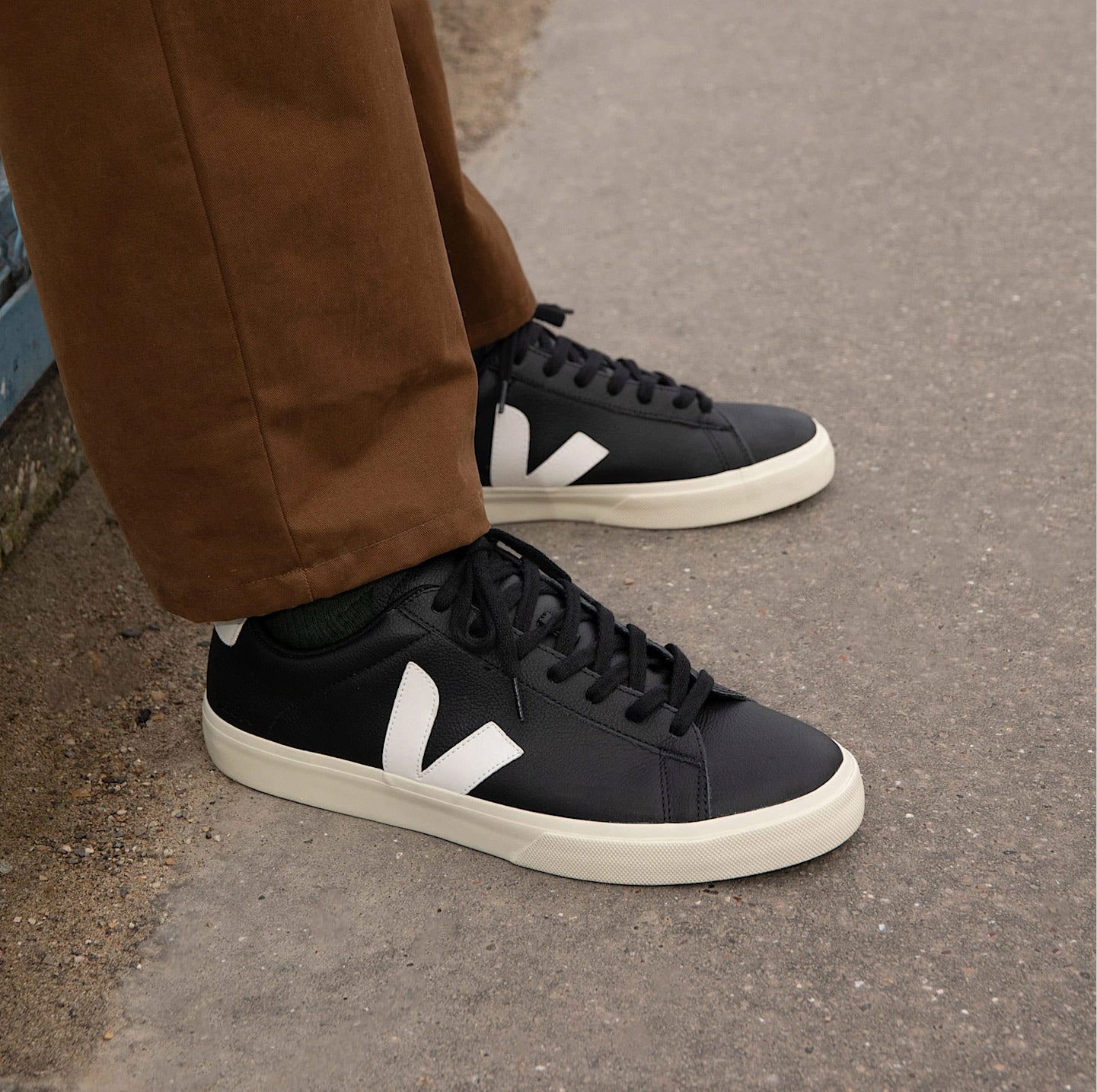 Model wearing Veja Campo Leather Trainers in Black & White