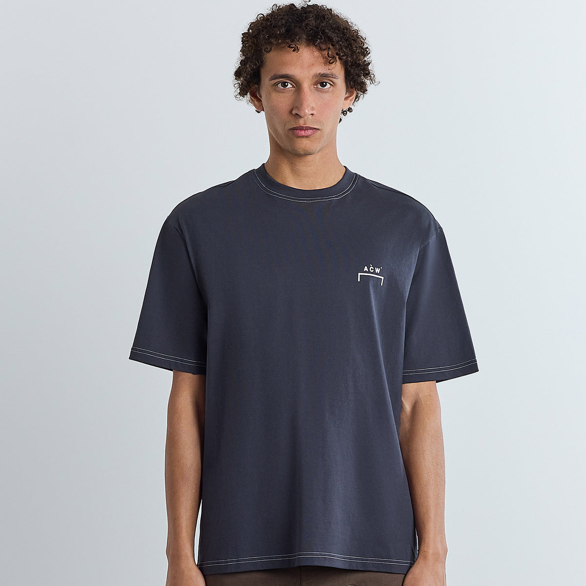 Model wearing A Cold Wall Moor Tshirt in midnight