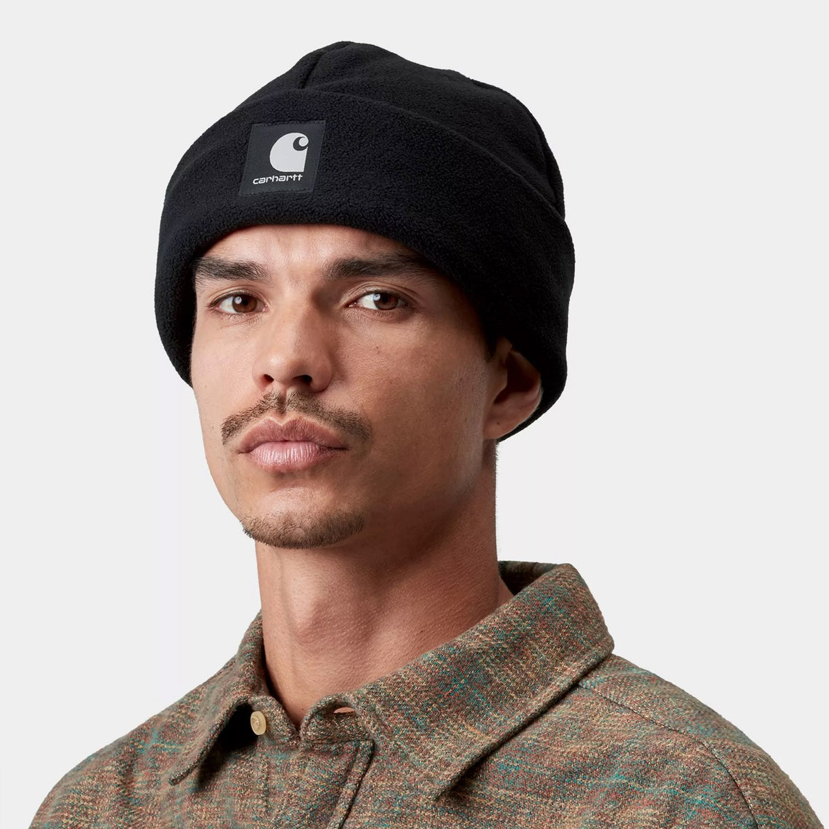 A man wearing Carhartt WIP Blevin Beanie in Black colourway