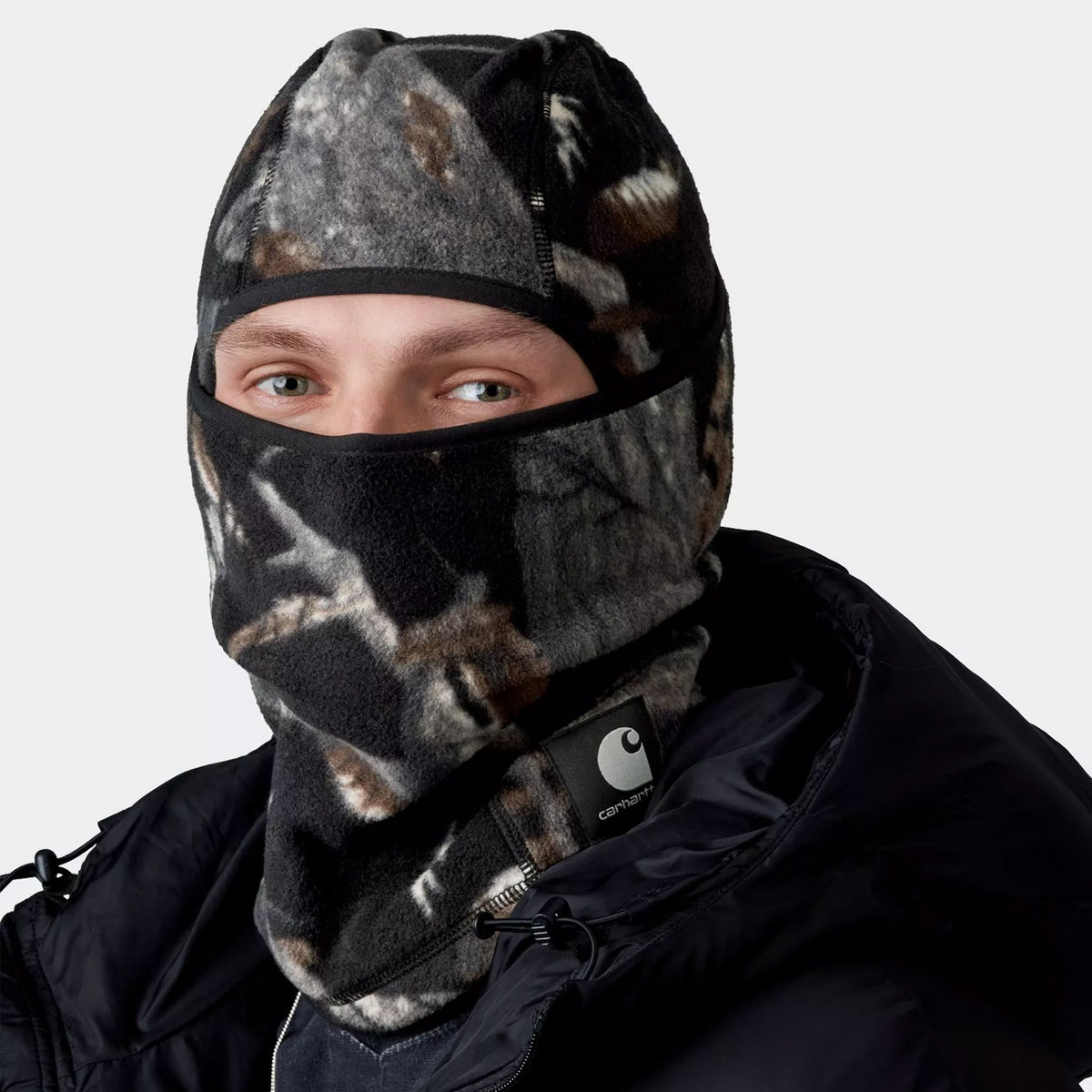 Man wearing Carhartt WIP Blevin Ski Mask Camo