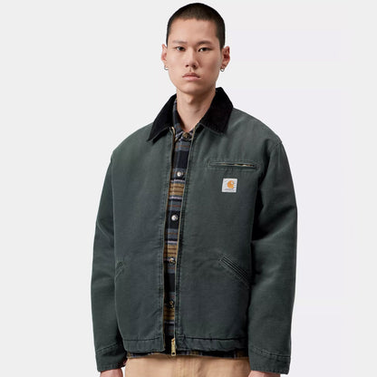 A model wearing Carhartt WIP OG Detroit Jacket (Winter) Raven / Black Stone Canvas