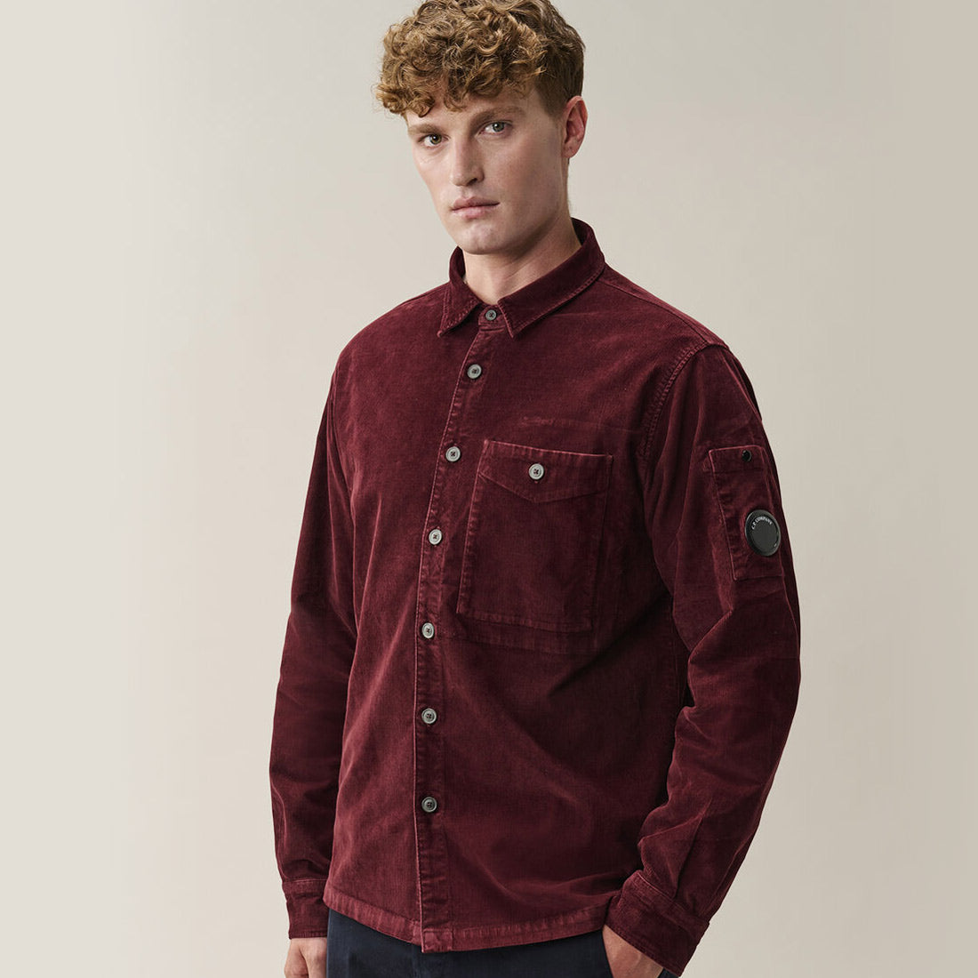 Man wearing CP Company Corduroy Long Sleeve Lens Button Shirt Andorra Red