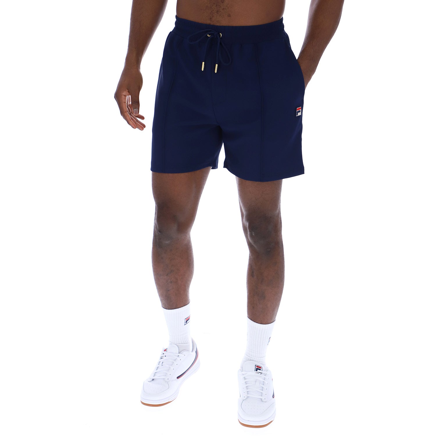 Model wearing Fila Eusebio Pin Tuck Shorts Navy