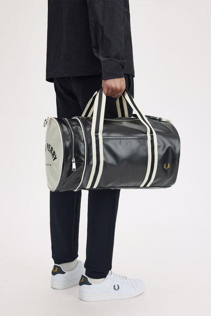 man holding the fred perry Classic Barrel Bag Black Ecru