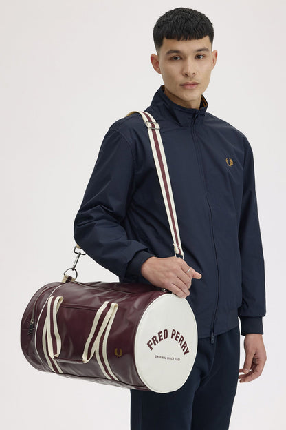 man wearing a fred perry Classic Barrel Bag Oxblood Ecru over his shoulder