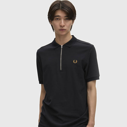 A man wearing fred perry Crepe Pique Zip Neck Polo Shirt Black