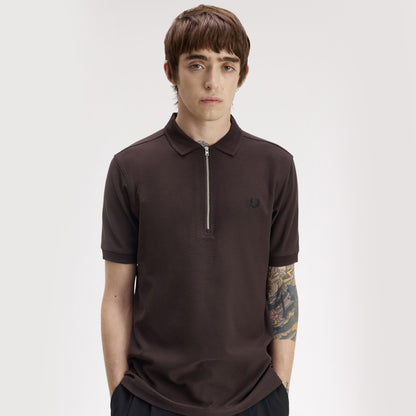 A model wearing fred perry Crepe Pique Zip Neck Polo Shirt Rich Brown