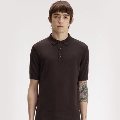 A man wearing fred perry Short Sleeve Cotton Knitted Polo Shirt Rich Brown