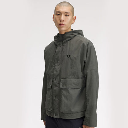A model wearing Fred Perry Cropped Ripstop Parka Field Green
