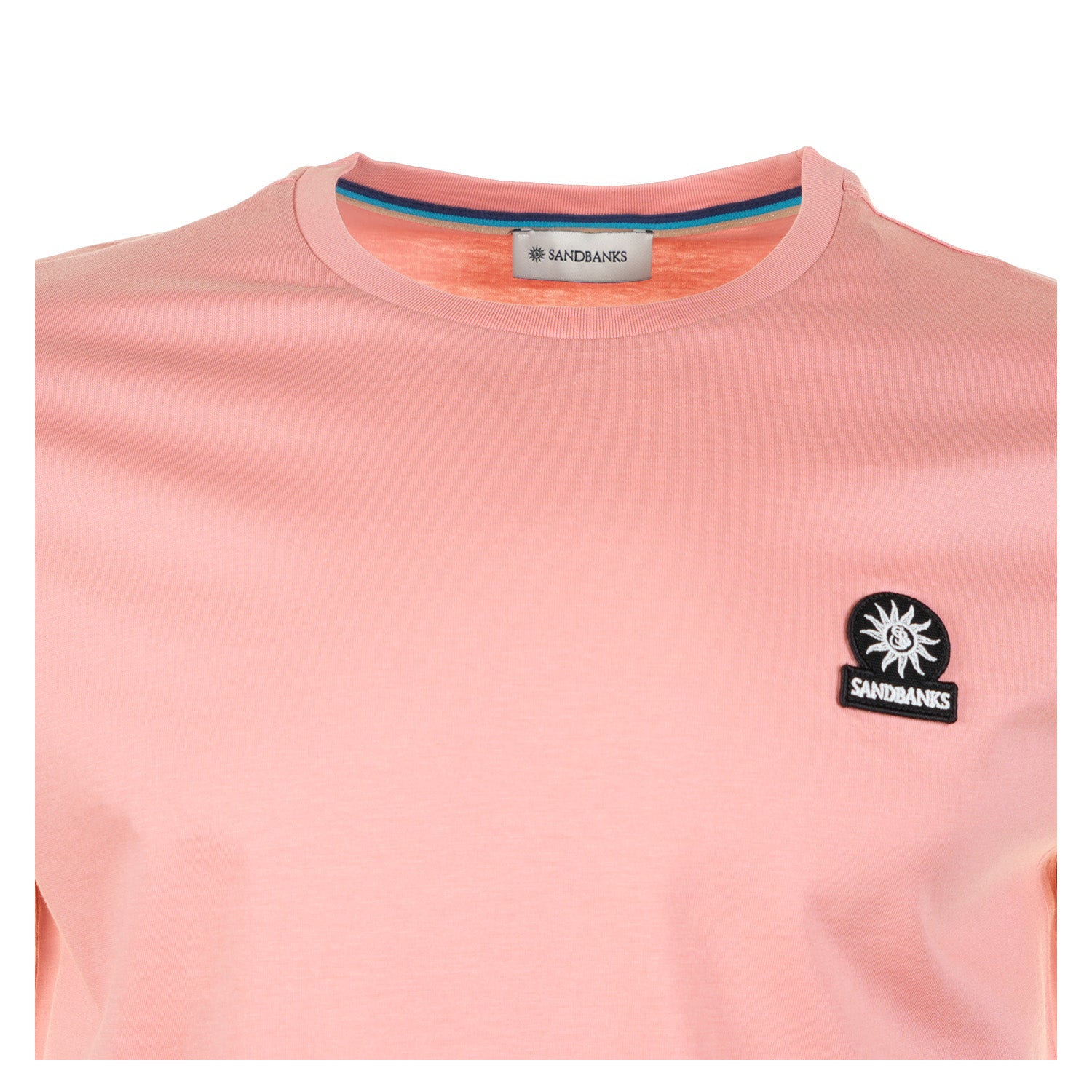 close up of neckline and badge of sandbanks t-shirt